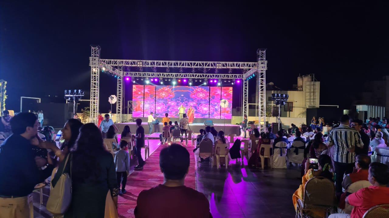 Percussion-led baraat under lasers